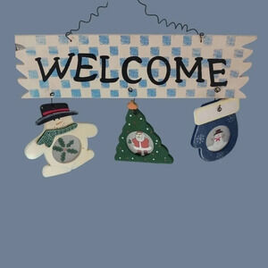 Welcome seasonal sign with black lettering